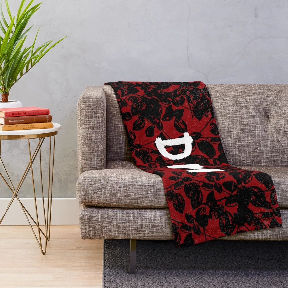 Textured plush blanket in black and red colors, inspired by Depeche Mode's Violator album