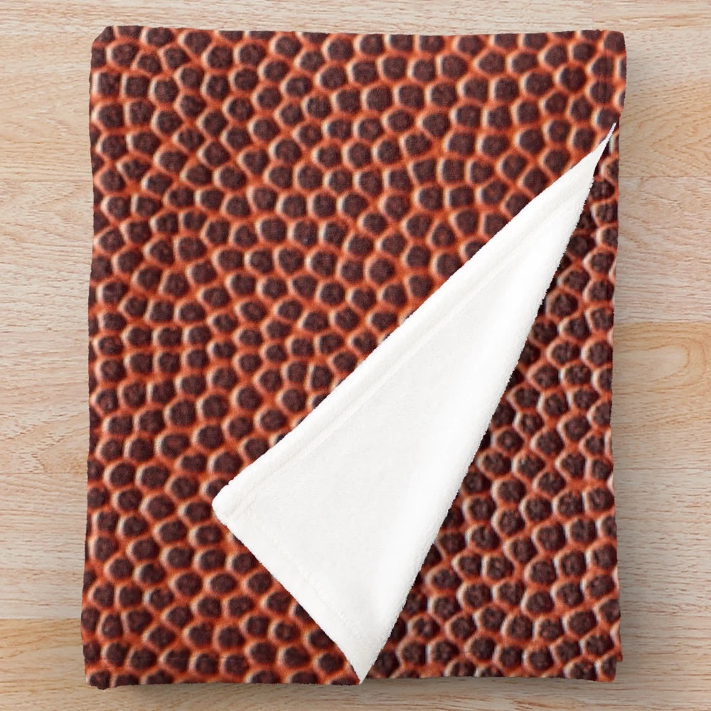 Soft, textured plush blanket with American football design