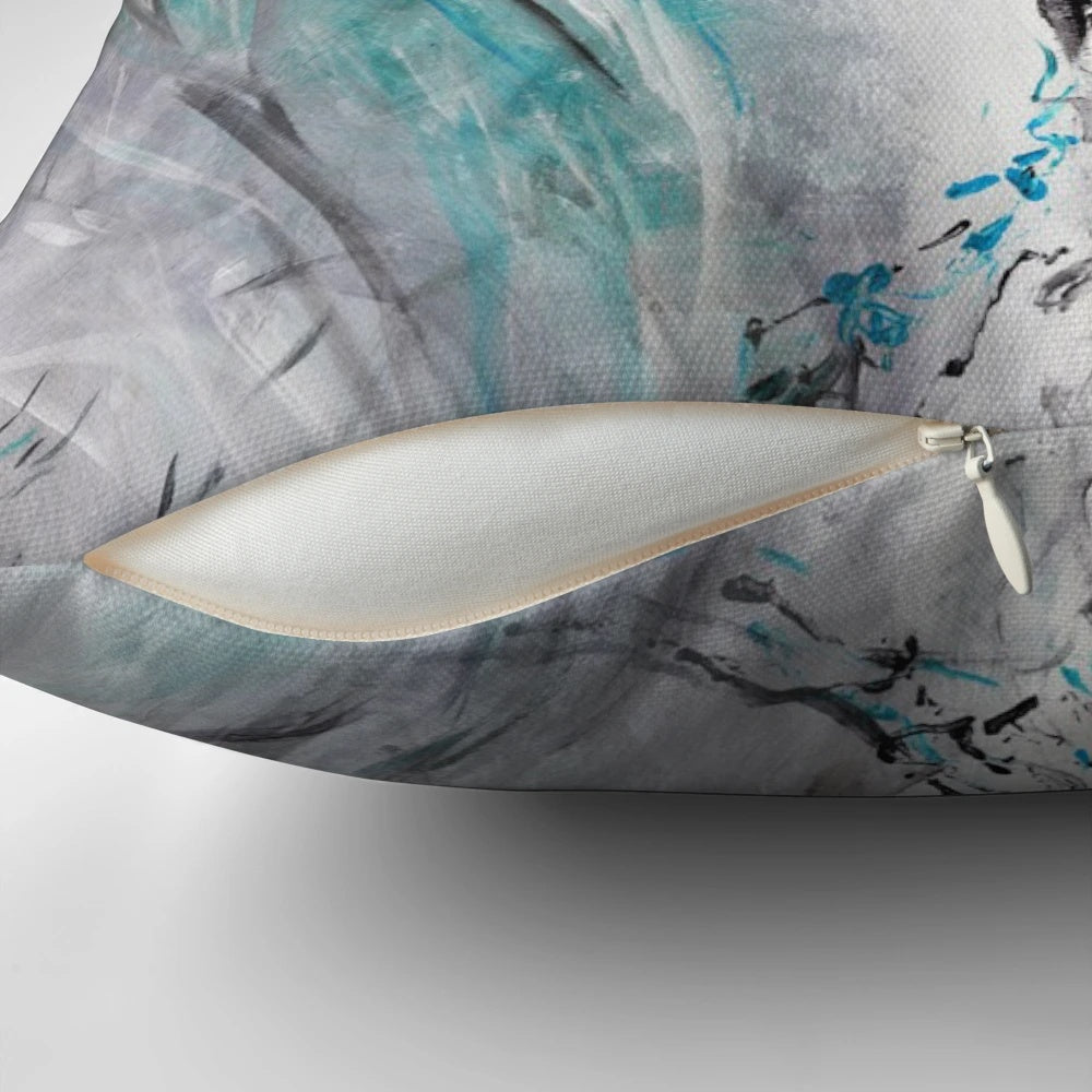Decorative teal and gray throw pillow featuring an abstract painting of flowing tree branches