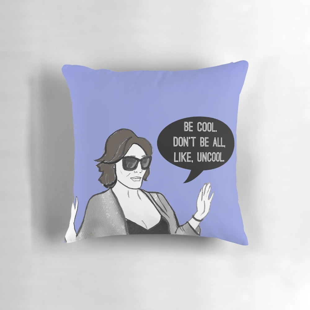 A stylish "Be Cool" pillow featuring the iconic Real Housewives of New York fashion and flair.