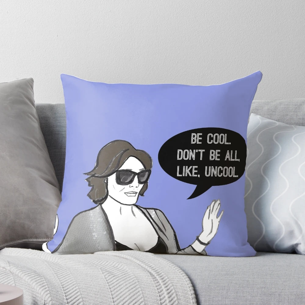 A stylish "Be Cool" pillow featuring the iconic Real Housewives of New York fashion and flair.