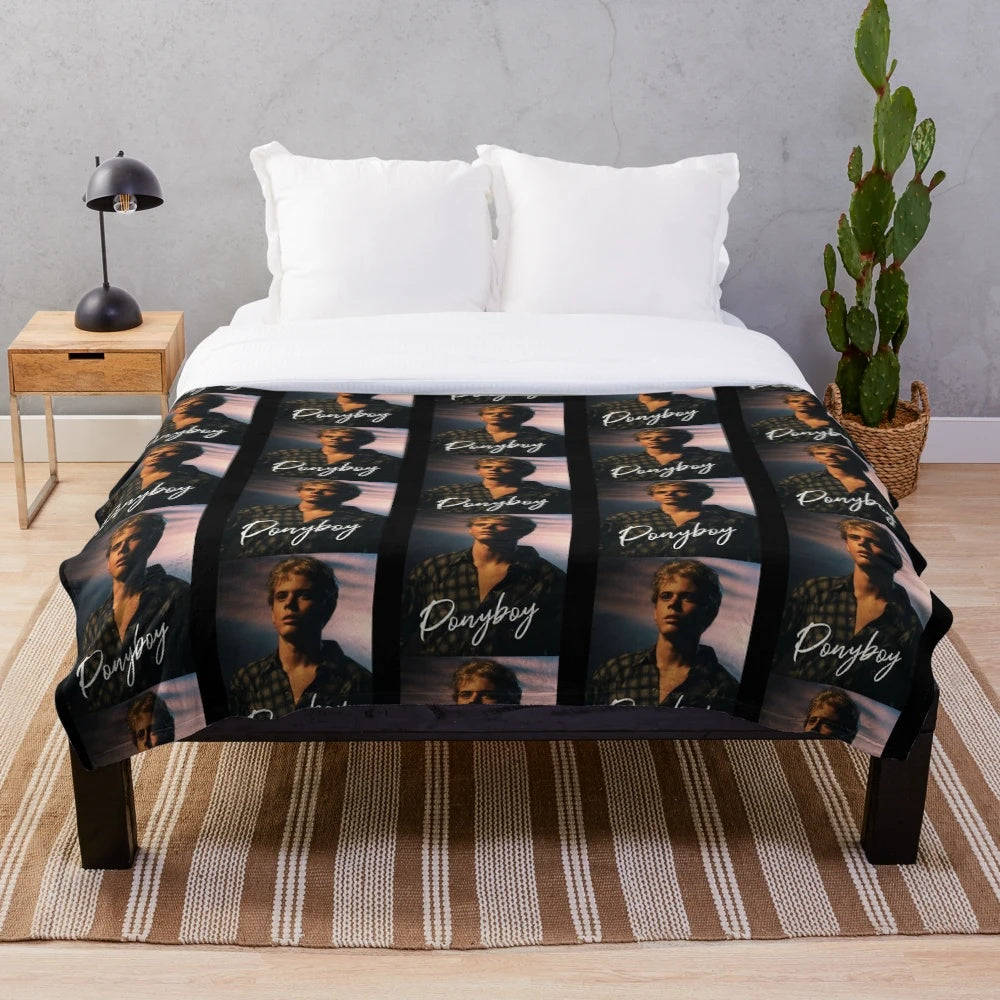 Ponyboy Curtis from the 80s movie "The Outsiders" printed on a plush blanket