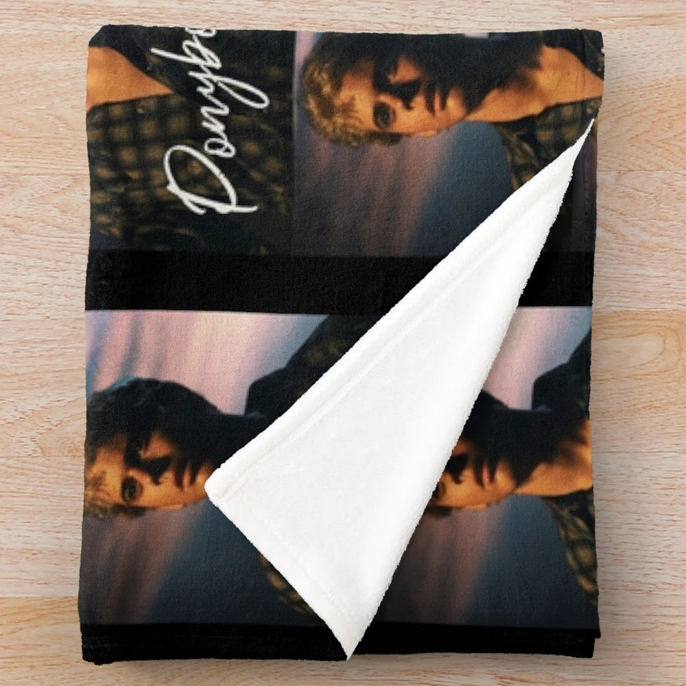 Ponyboy Curtis from the 80s movie "The Outsiders" printed on a plush blanket