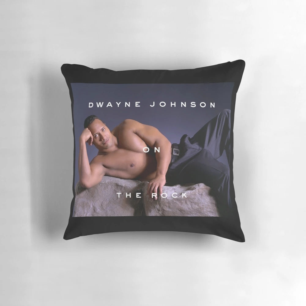 A plush pillow featuring a stylized image of Dwayne "The Rock" Johnson, the popular movie star and champion.