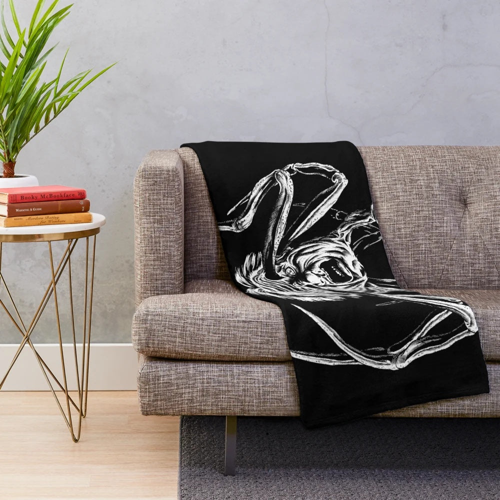 Plush blanket featuring a spider-like creature inspired by the 1982 film "The Thing