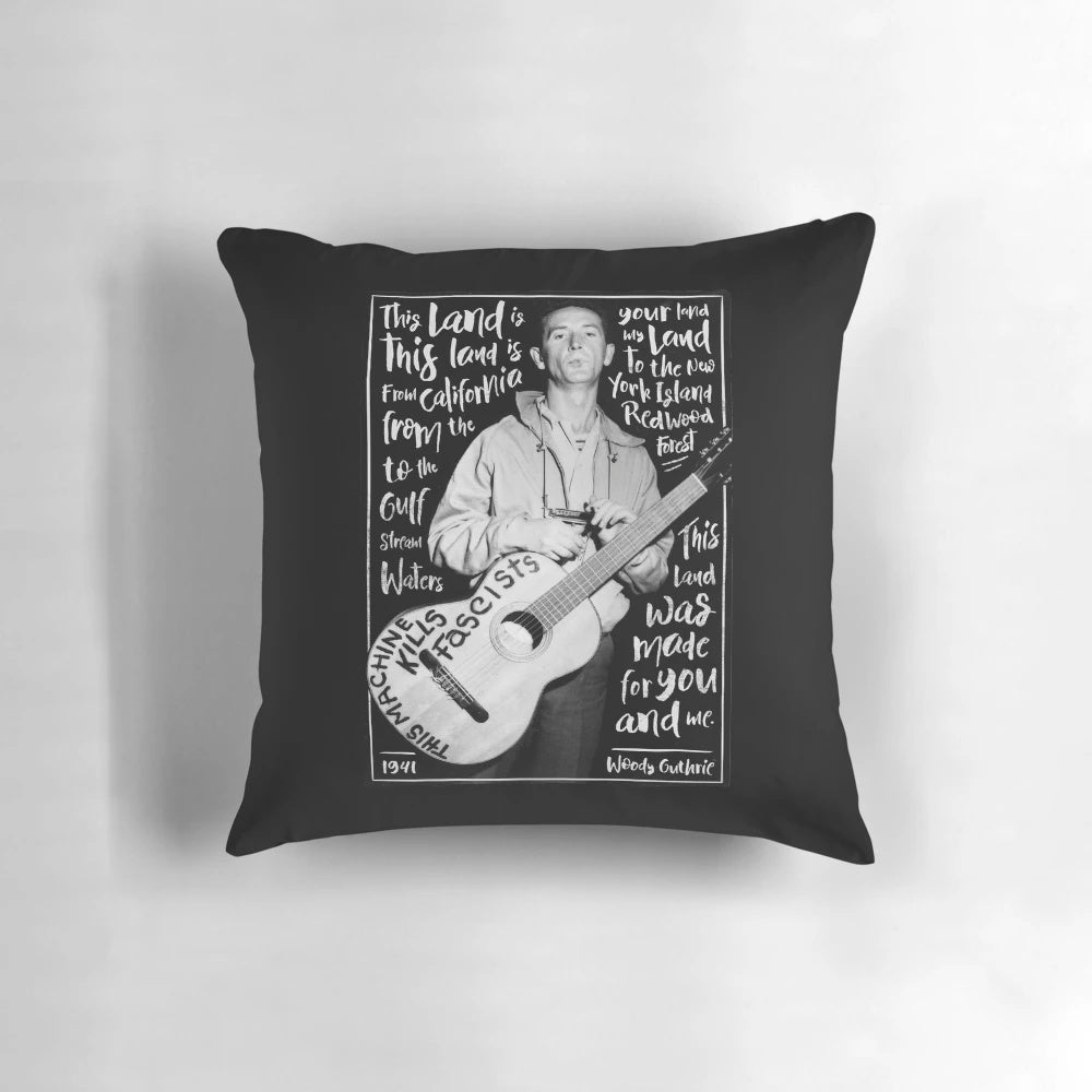 Decorative pillow featuring the lyrics and imagery of Woody Guthrie's iconic American folk song "This Land Is Your Land