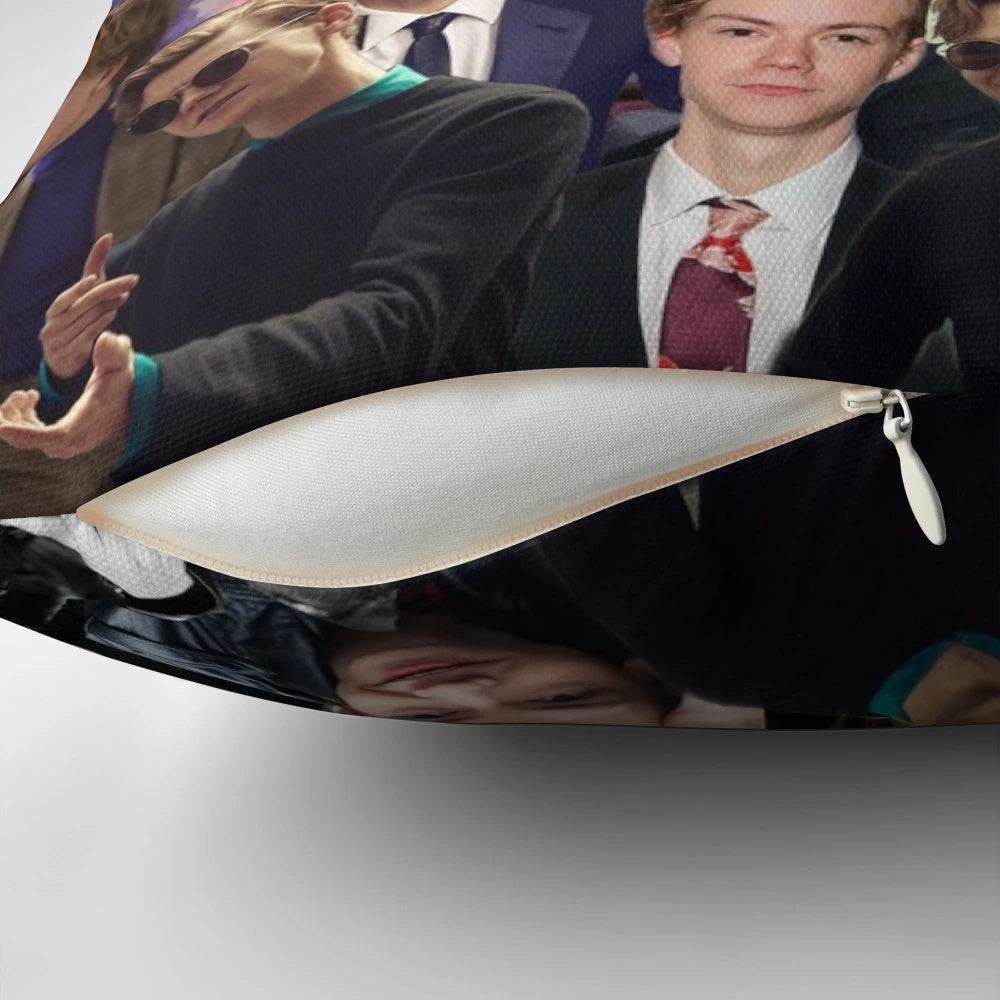 Artistic collage pillow featuring actor Thomas Brodie-Sangster in various roles