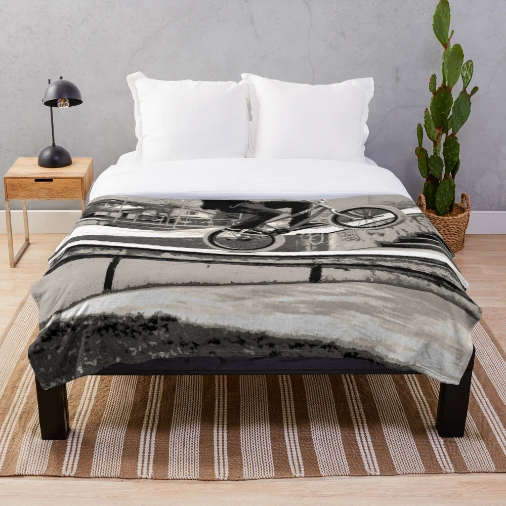 Soft and cozy plush blanket featuring a BMX-inspired design for bike lovers