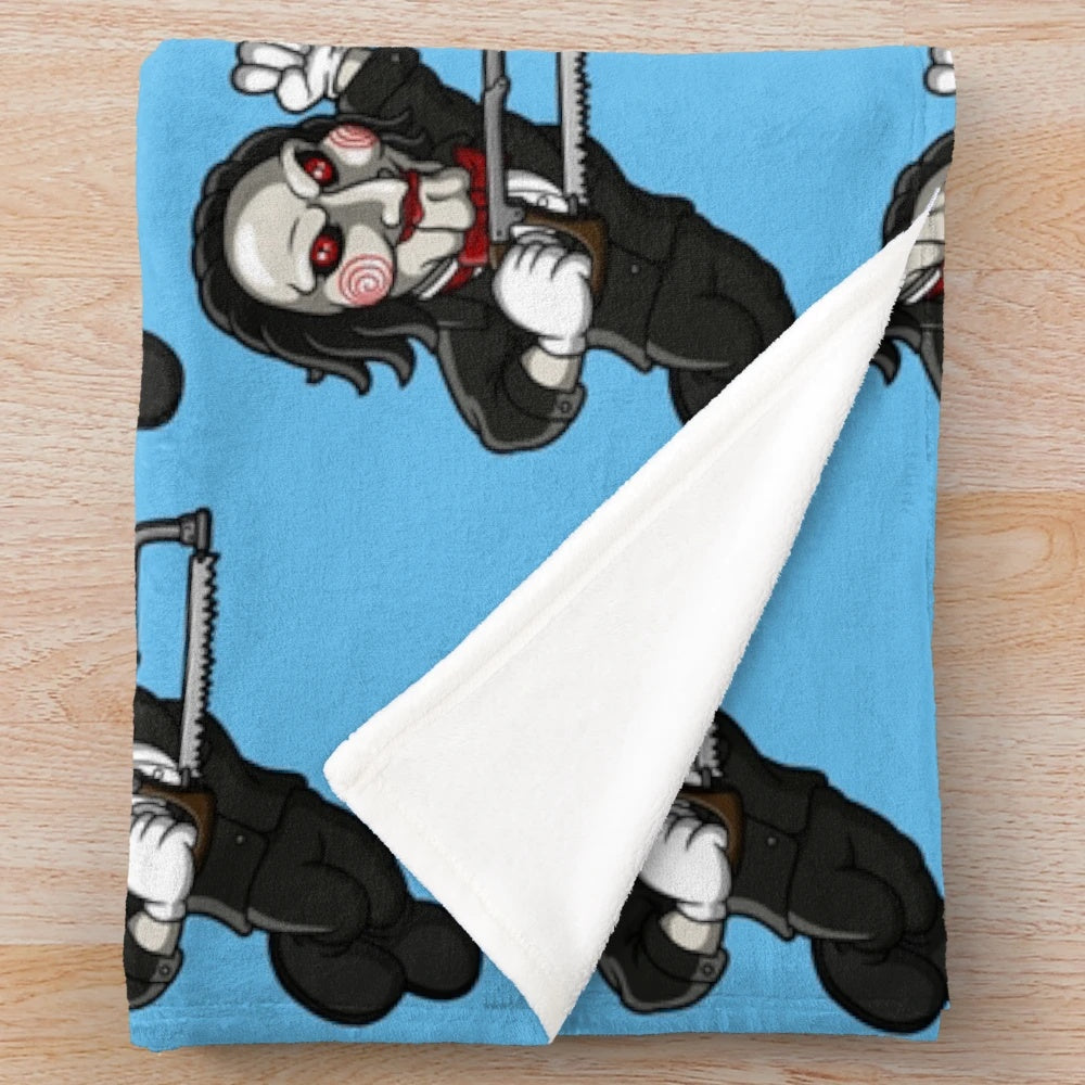Saw-themed plush blanket with horror movie imagery
