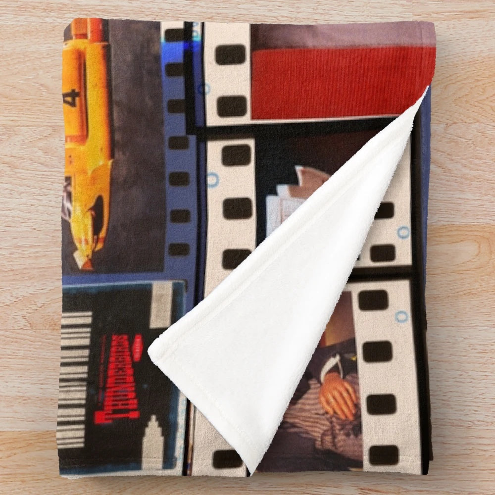 Thunderbirds-inspired plush blanket featuring the Tracy family and sci-fi elements