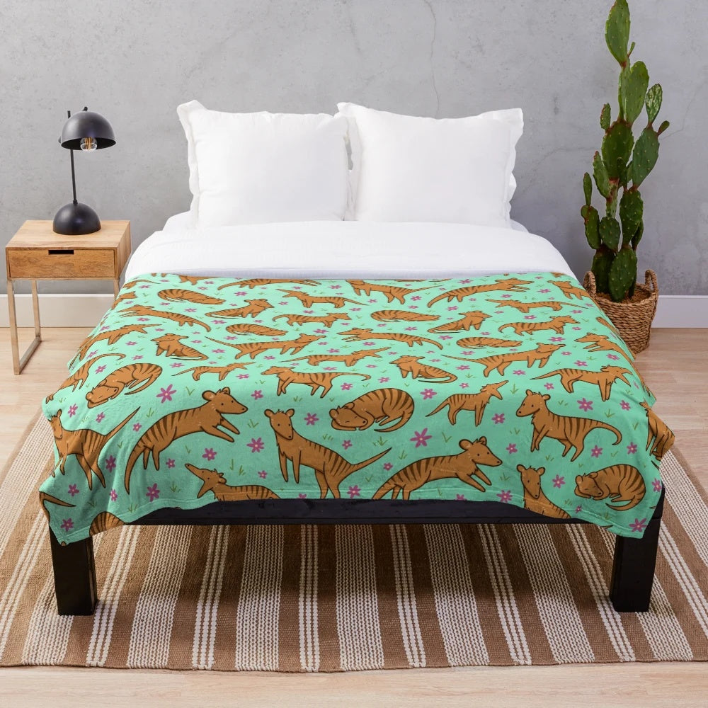 Thylacine pattern plush blanket with floral and nature inspired design