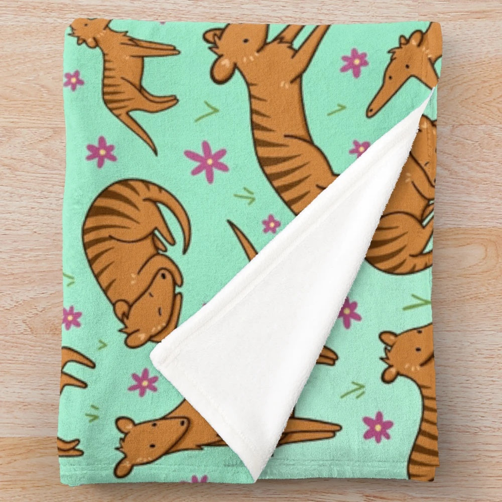 Thylacine pattern plush blanket with floral and nature inspired design