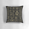 Ornate Egyptian hieroglyphs and deities depicted in shimmering gold on a black pillow