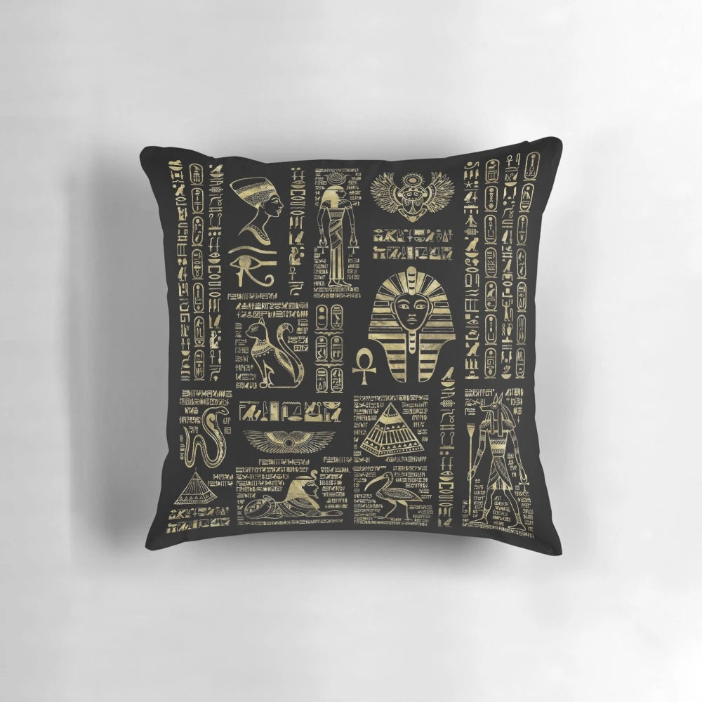 Ornate Egyptian hieroglyphs and deities depicted in shimmering gold on a black pillow