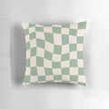 Sage green checkerboard pattern pillow with a vintage, retro aesthetic