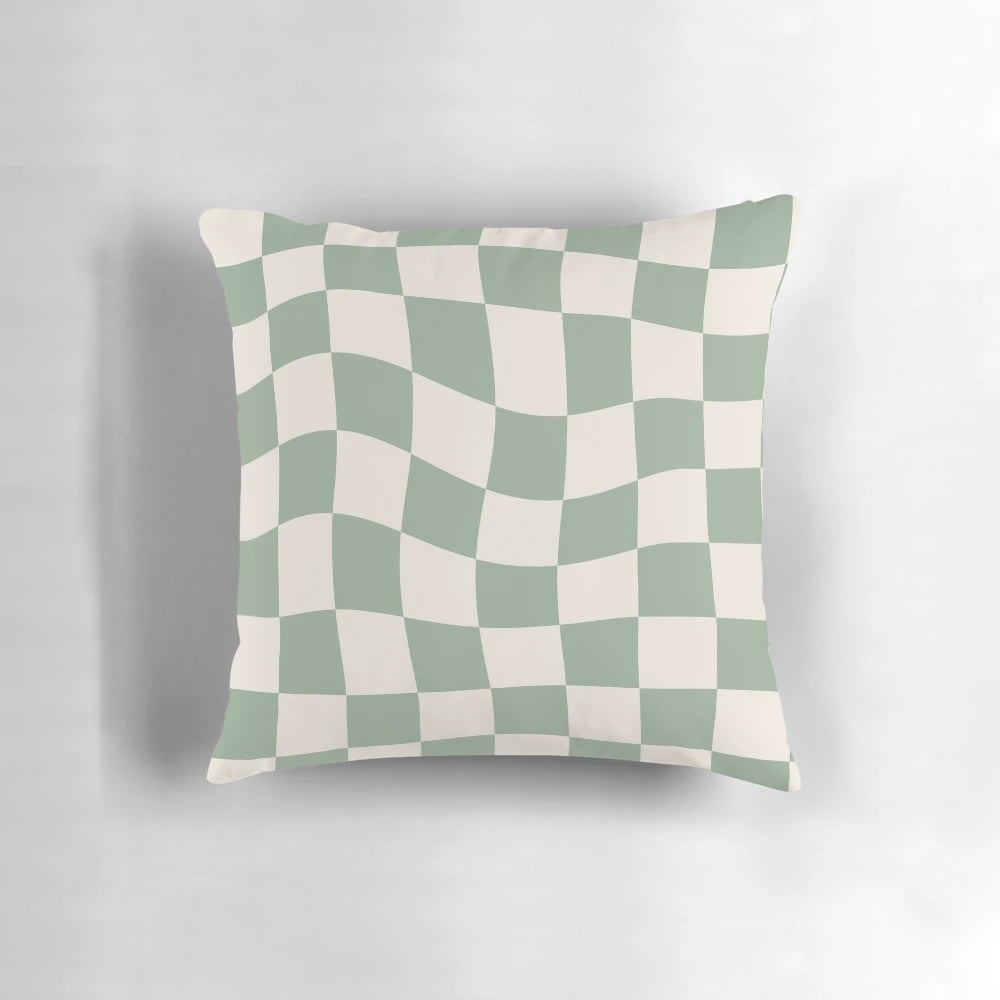 Sage green checkerboard pattern pillow with a vintage, retro aesthetic