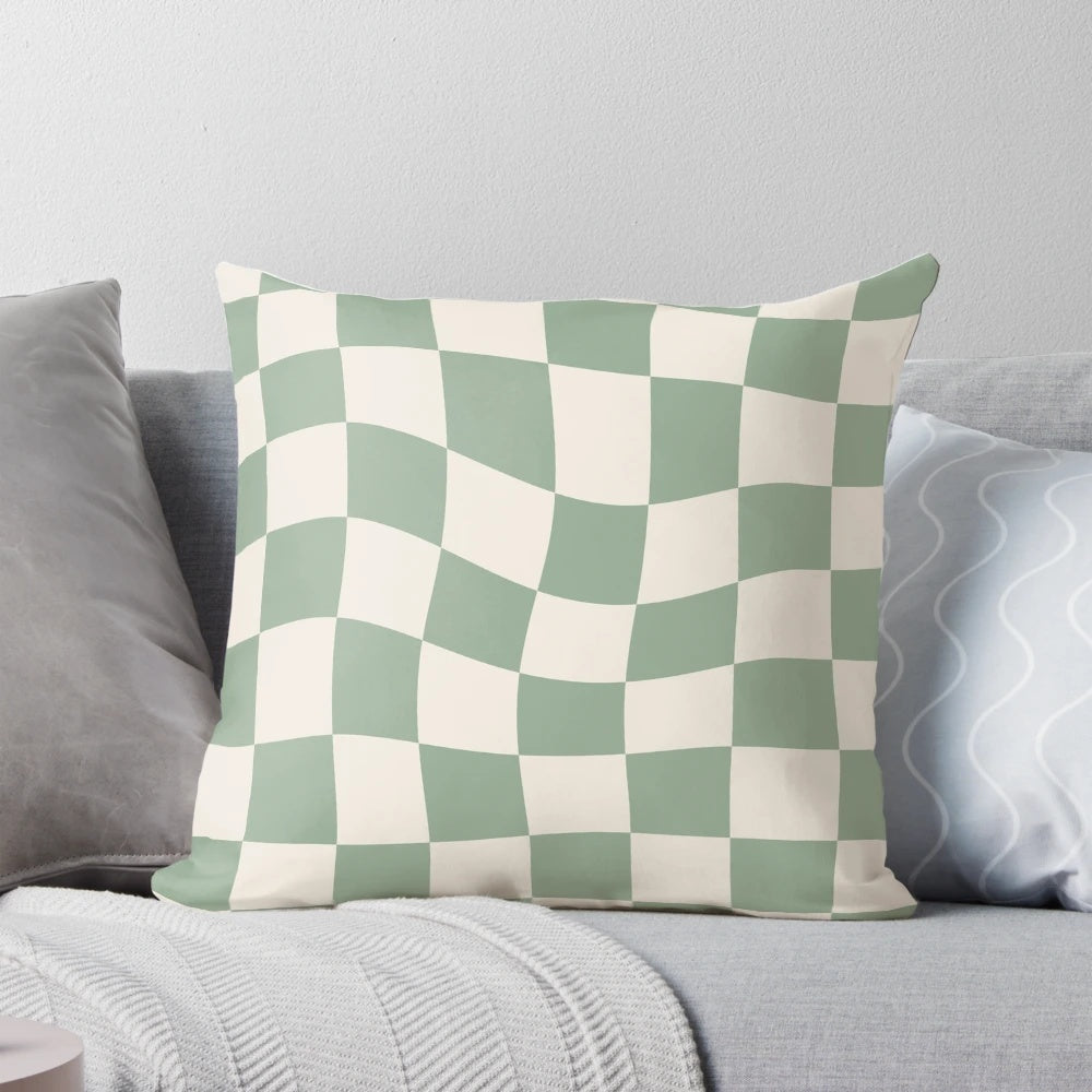 Sage green checkerboard pattern pillow with a vintage, retro aesthetic