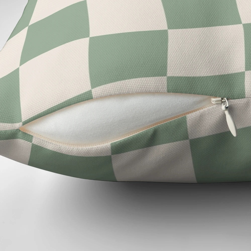 Sage green checkerboard pattern pillow with a vintage, retro aesthetic
