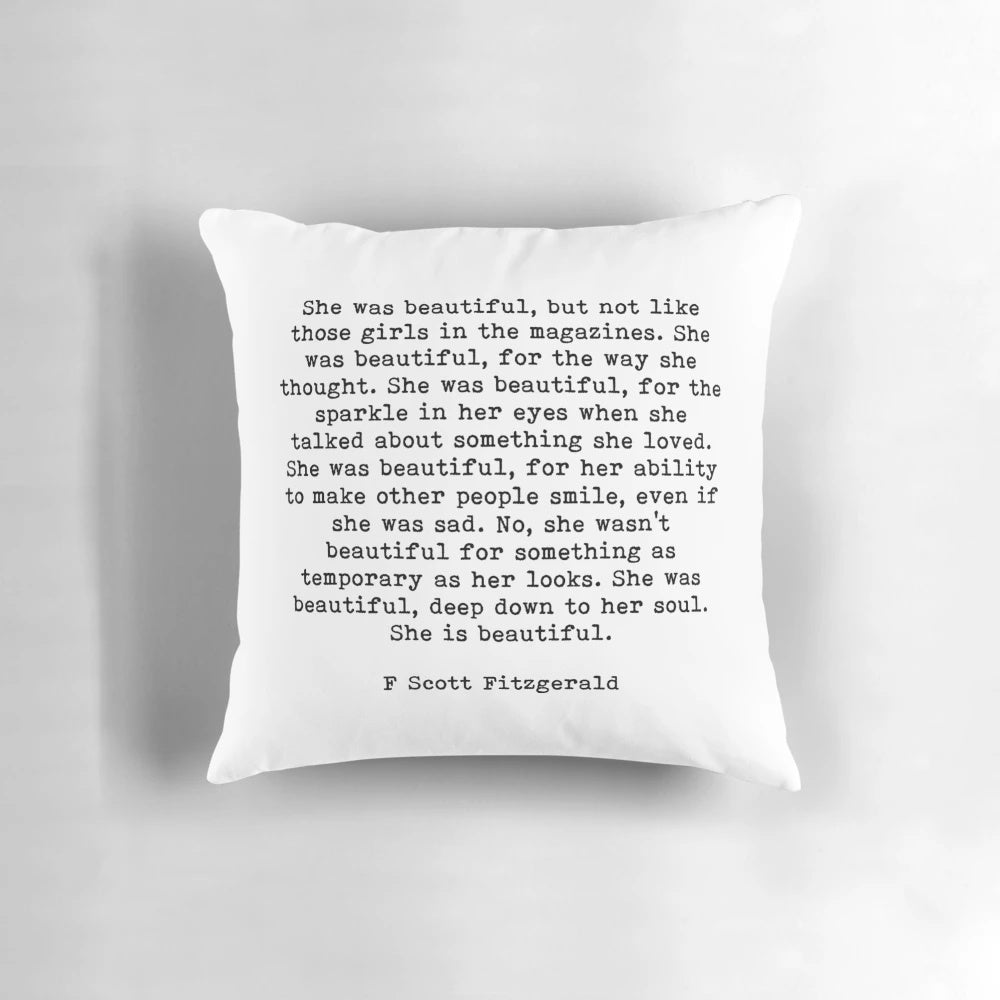 Decorative pillow featuring the 'She Was Beautiful' quote from F. Scott Fitzgerald's 'The Great Gatsby