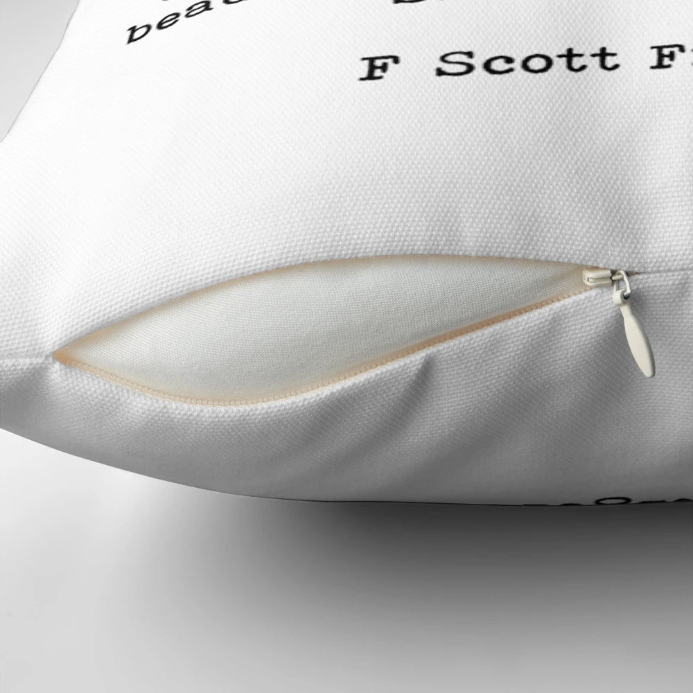 Decorative pillow featuring the 'She Was Beautiful' quote from F. Scott Fitzgerald's 'The Great Gatsby