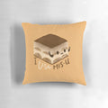 A soft, plush pillow in the shape of a traditional Italian tiramisu dessert, perfect for couples in long distance relationships.