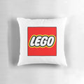 Colorful toile print lego pillow with a blue and white design