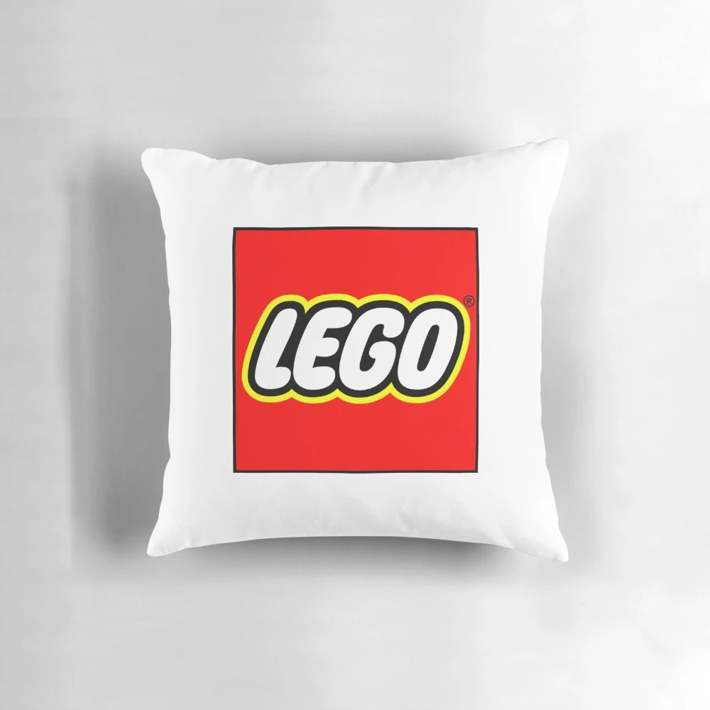 Colorful toile print lego pillow with a blue and white design