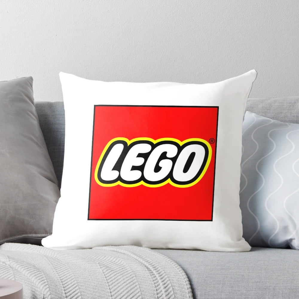 Colorful toile print lego pillow with a blue and white design