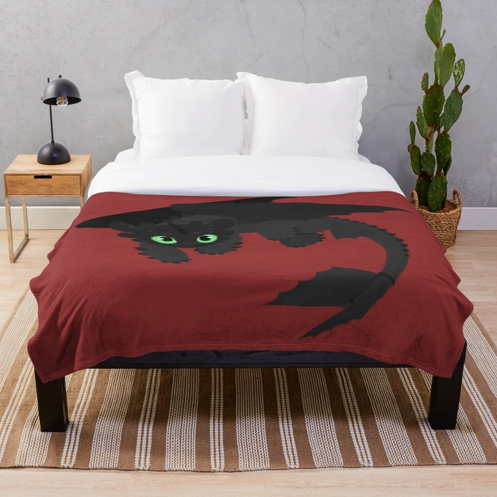 Toothless-inspired plush blanket featuring the iconic Night Fury dragon from How to Train Your Dragon
