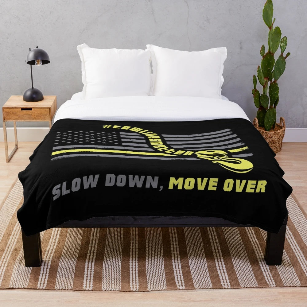 Tow truck operator plush blanket with "Slow Down Move Over" message
