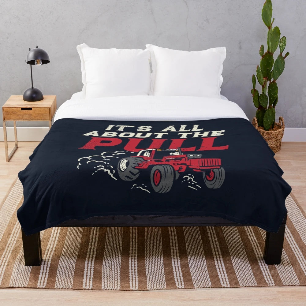 Tractor plush blanket on a couch