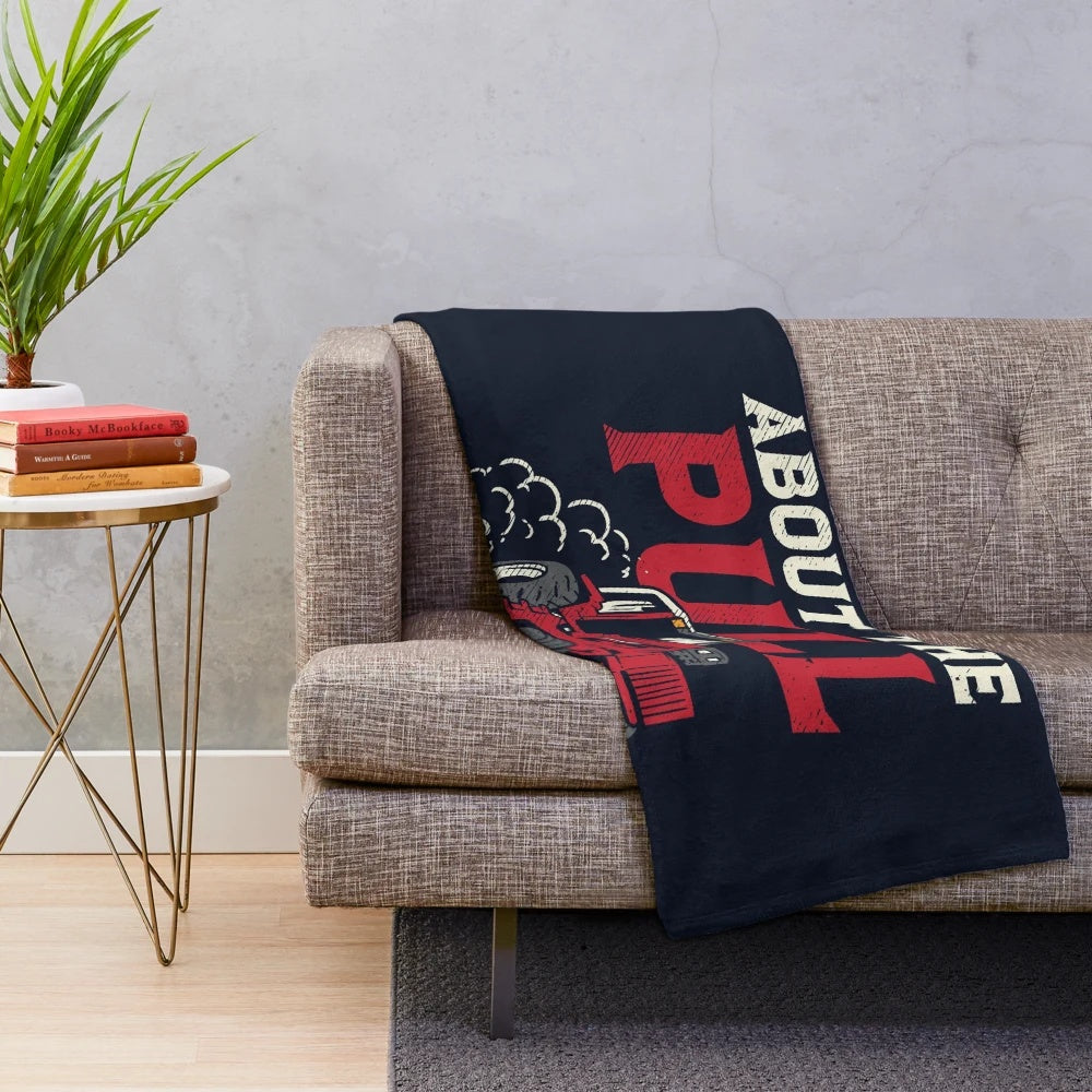 Tractor plush blanket on a couch