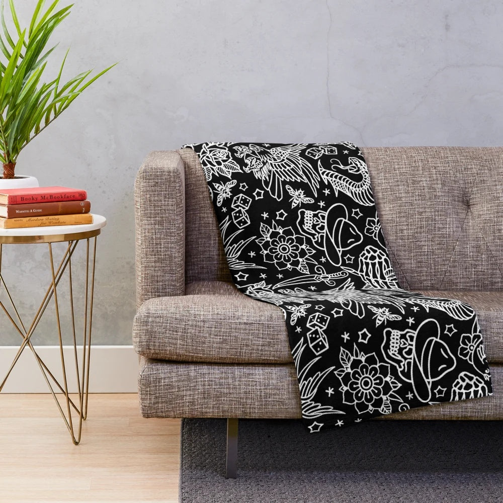 Traditional tattoo inspired plush blanket featuring eagle, skull, and other classic tattoo designs