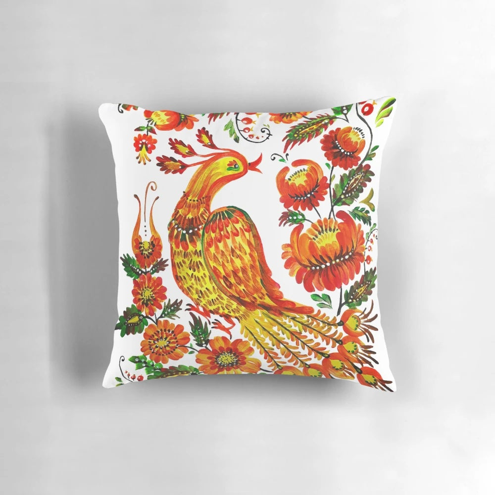 Vibrant Petrykivka-style illustration of a firebird on a decorative throw pillow