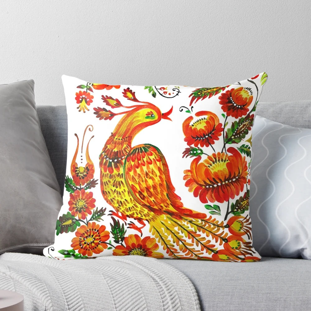 Vibrant Petrykivka-style illustration of a firebird on a decorative throw pillow
