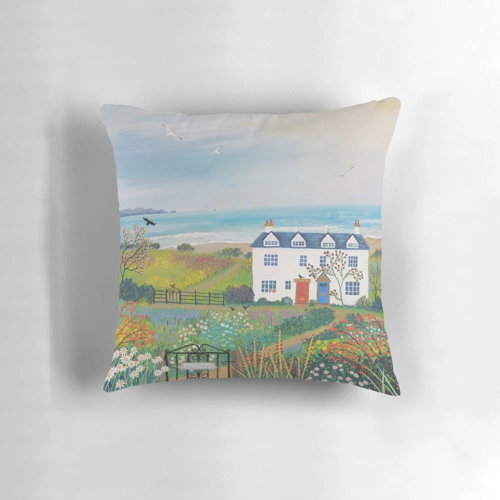 Pillow featuring a serene coastal landscape with beach cottages