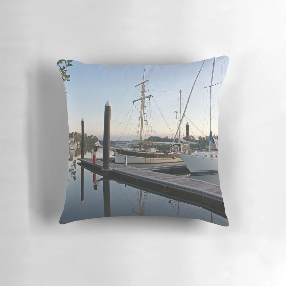Pillow featuring a peaceful morning scene on the Johnstone River in Innisfail, Far North Queensland, with moored boats and wooden structures.