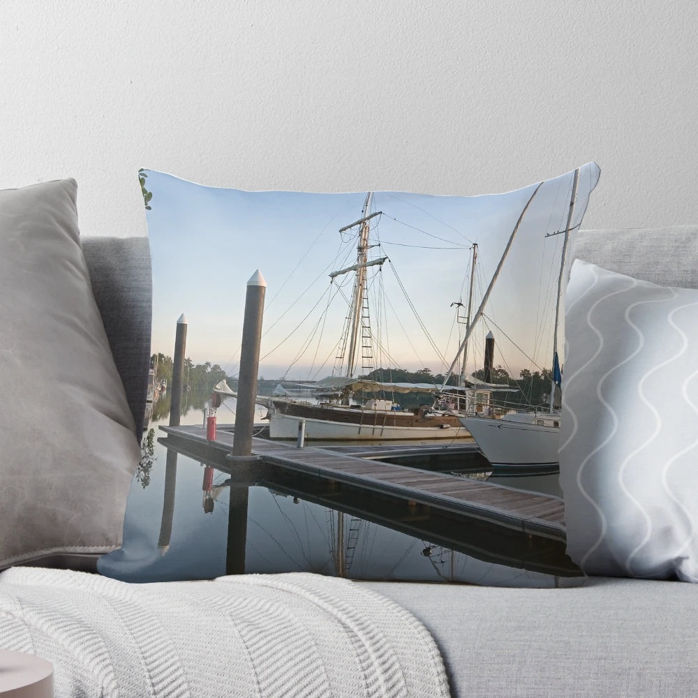 Pillow featuring a peaceful morning scene on the Johnstone River in Innisfail, Far North Queensland, with moored boats and wooden structures.