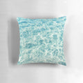 A plush, blue water-themed pillow that invites you to escape to a tropical paradise