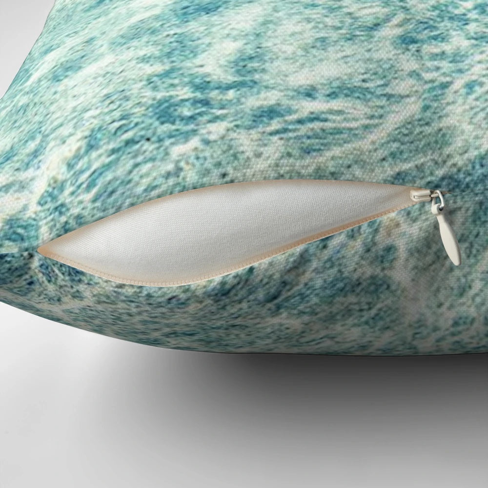 A plush, blue water-themed pillow that invites you to escape to a tropical paradise