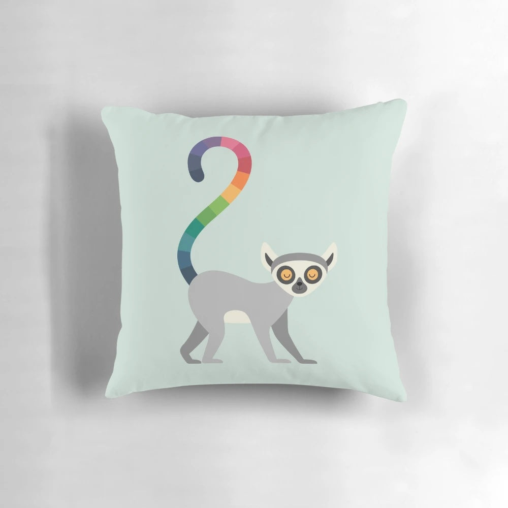 A vibrant rainbow-colored pillow featuring a serene ring-tailed lemur design, perfect for nature-inspired home decor.