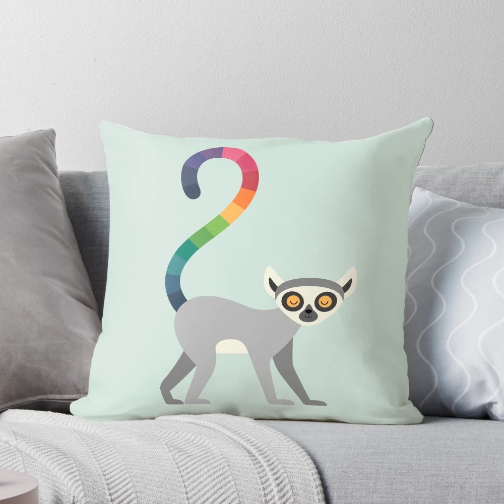 A vibrant rainbow-colored pillow featuring a serene ring-tailed lemur design, perfect for nature-inspired home decor.