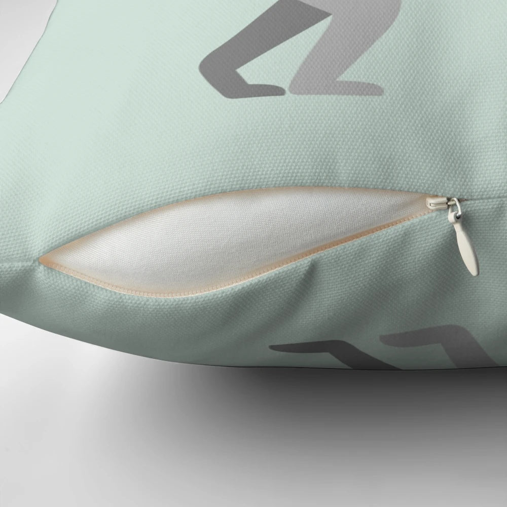 A vibrant rainbow-colored pillow featuring a serene ring-tailed lemur design, perfect for nature-inspired home decor.