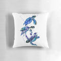 Watercolor painting of three sea turtles swimming in a blue and purple underwater scene, printed on a soft, decorative pillow.