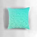 Turquoise and blue ocean waves crashing on a tropical beach, printed on a plush pillow