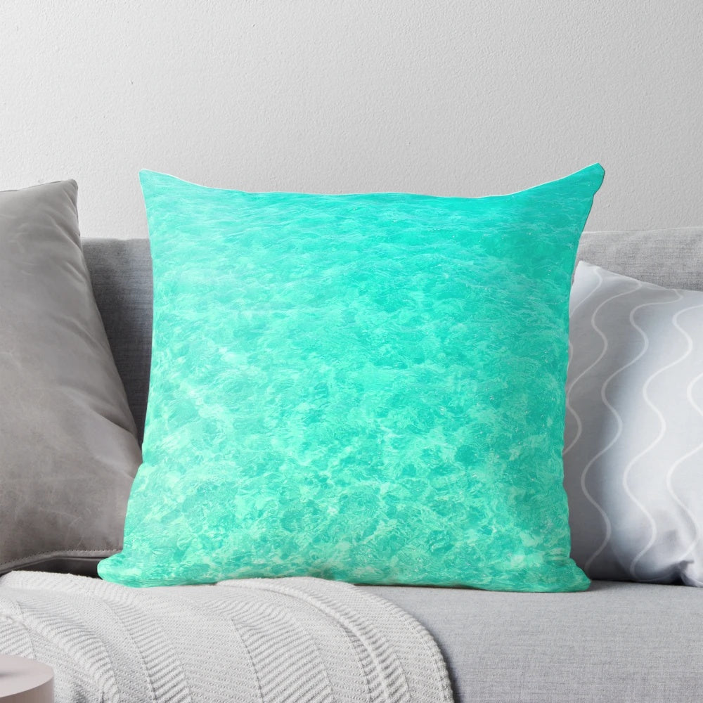 Turquoise and blue ocean waves crashing on a tropical beach, printed on a plush pillow
