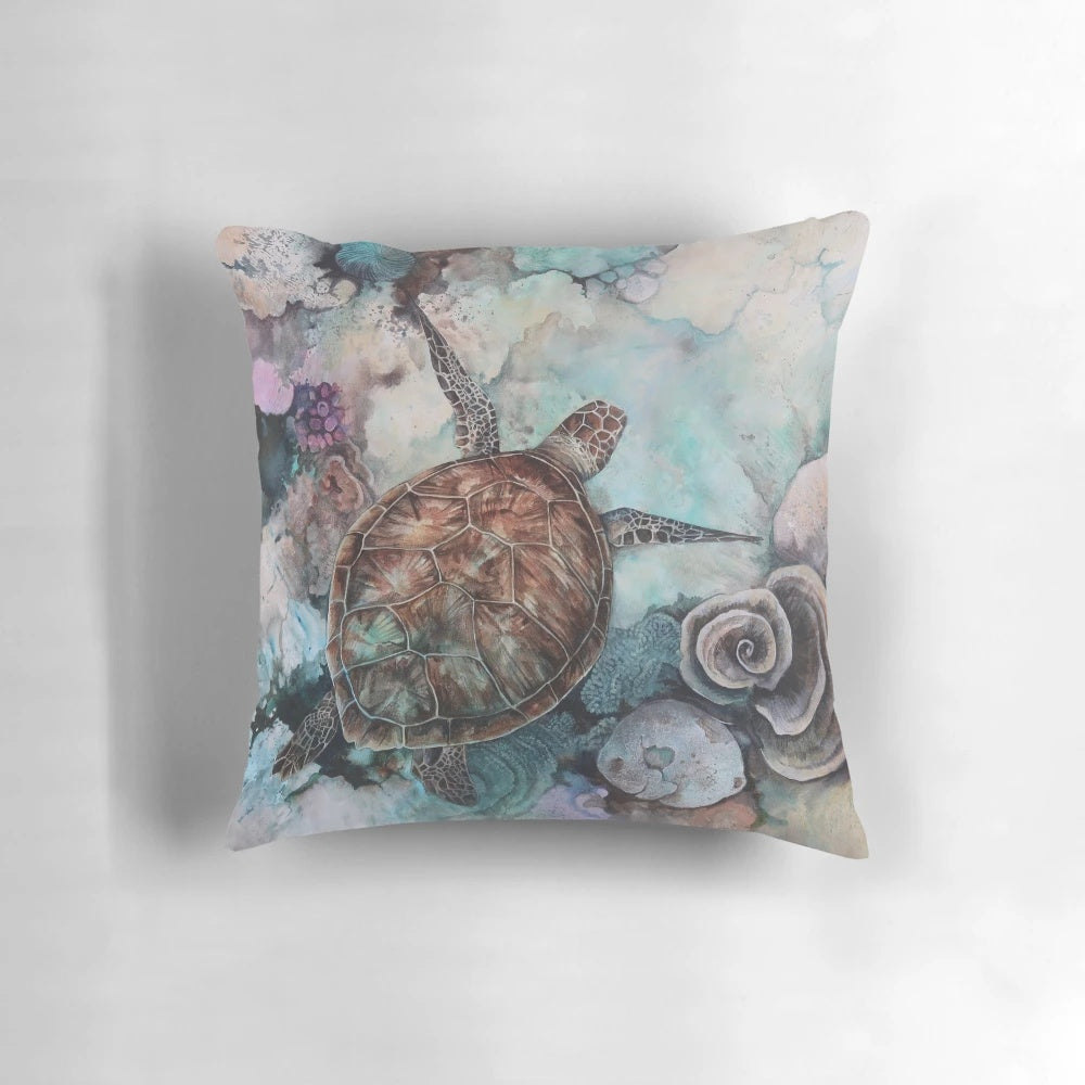 Decorative pillow featuring a vibrant illustration of a turtle swimming among a coral reef