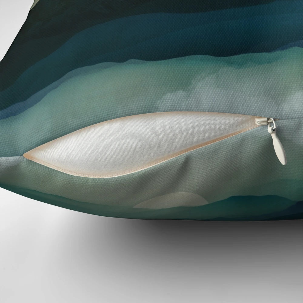 Pillow featuring a serene water reflection landscape in shades of blue, teal, and gold