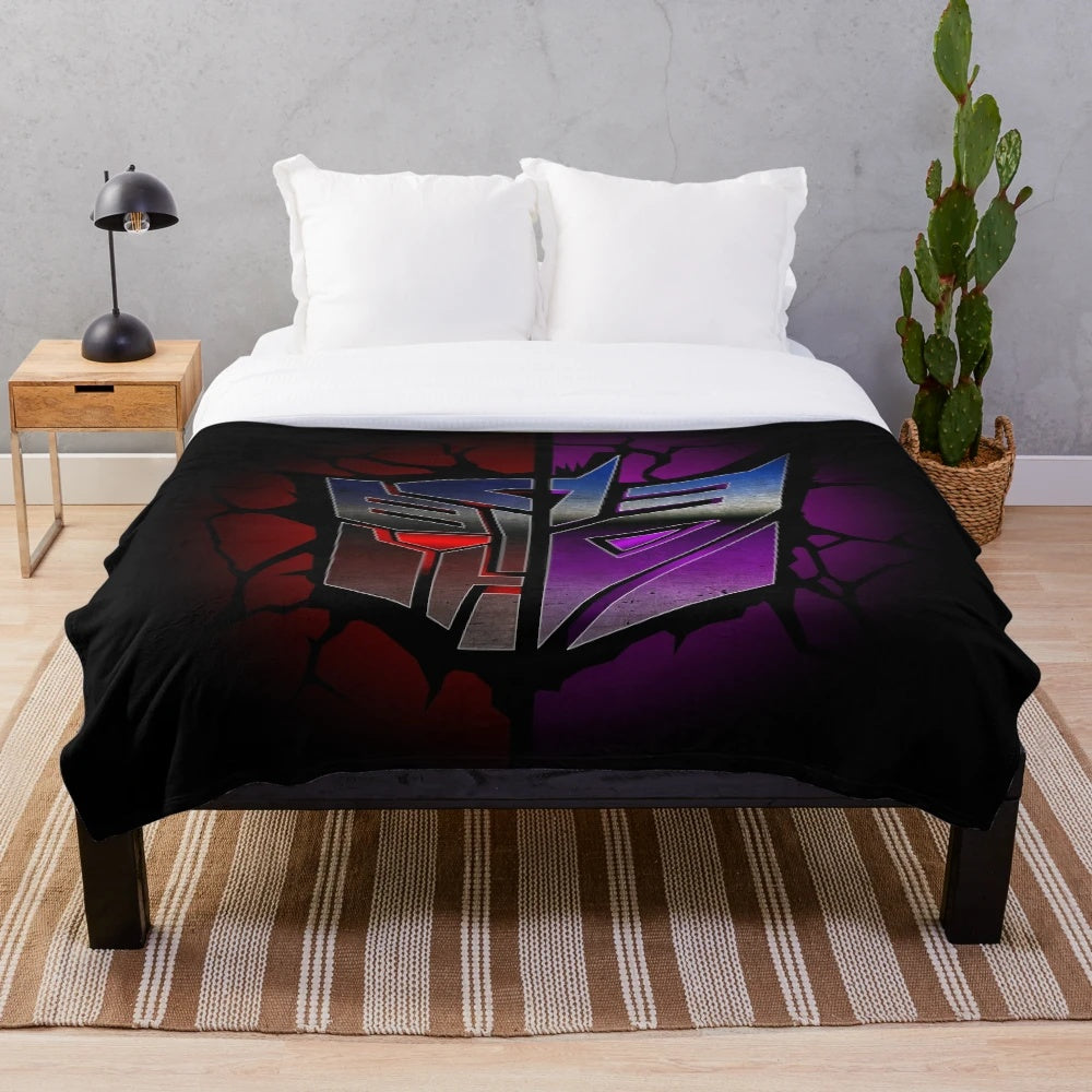 Transformers-inspired plush blanket featuring Autobots and Decepticons