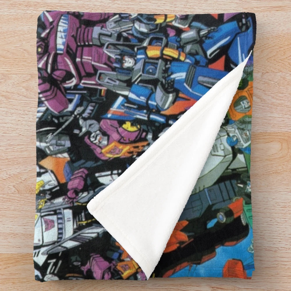 Transformers-inspired plush blanket featuring Cybertrons and Destrons